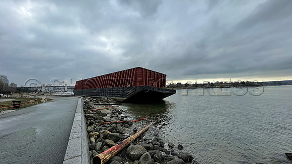 Un-moored barge runs aground November 15, 2021 at Vancouver seawall following an atmospheric river rainstorm.