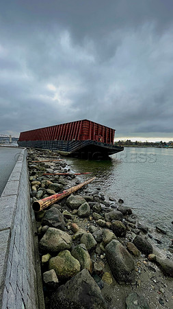 Un-moored barge runs aground November 15, 2021 at Vancouver seawall following an atmospheric river rainstorm.